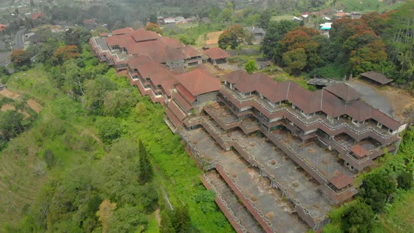 Aerial Shot of the Abandoned and Mysterious Hotel in Bedugul. Indonesia, Bali Island. Bali Travel alt