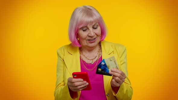 Senior Old Granny Woman Using Credit Plastic Cards and Mobile Phone Purchases Online Shopping alt