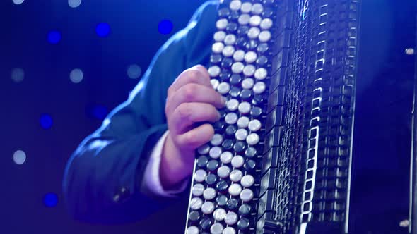 A Man Emotionally Plays Accordion Closeup of Instrument and Hand