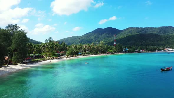 Aerial tourism of paradise resort beach wildlife by blue green sea with white sandy background of ad alt