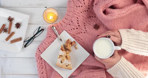 Woman taking warm breakfast in a cold winter day