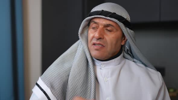 Closeup Portrait of Angry Middle Eastern Man Looking at Camera with Dissatisfied Facial Expression alt