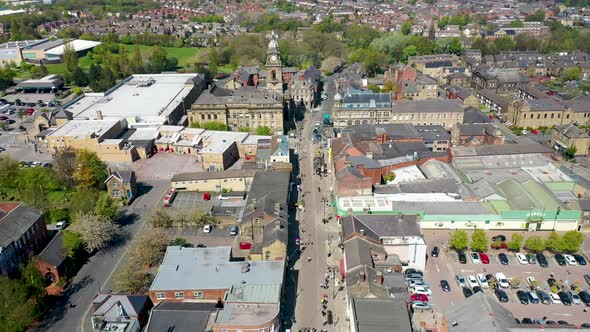Aerial footage of the village of Morley in Leeds UK, showing an aerial view of the main street alt