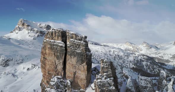 Forward Aerial Toward Majestic Cinque Torri Mounts Showing Steep Rocky Cliff