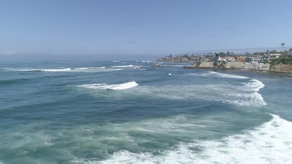Aerial view of the ocean and the coastline alt