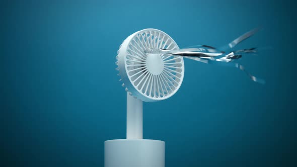 Small White Ventilator with Silver Strips Blowing