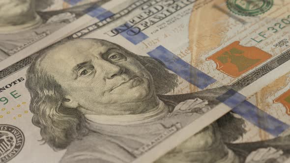 Paper currency in 100 USD denominations slow tilt 4K 2160p 30fps UltraHD footage - Dollar  banknotes alt