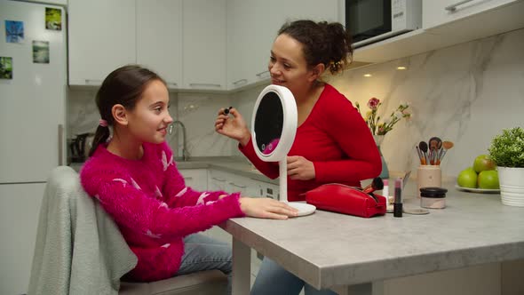 Happy Preteen Girl Looking at Vanity Mirror Checking Makeup Indoors, Stock Footage