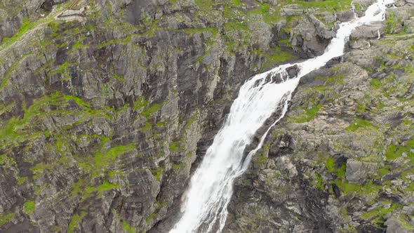 The Cascades Over Rugged Mountains On Trollstigen Road In Norway. - Aerial Drone Shot alt