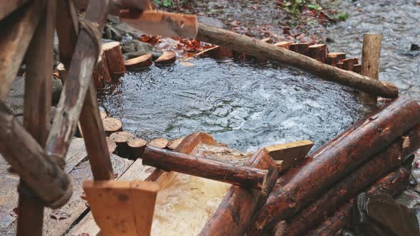 The Mill Drives the Water in the River in the Autumn Forest in Cloudy Weather alt
