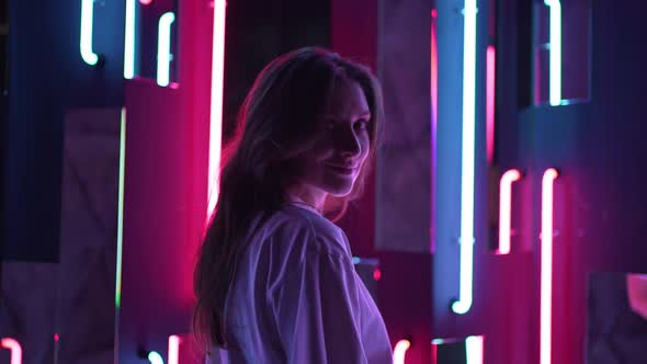 Woman's Smile in the Light of Neon