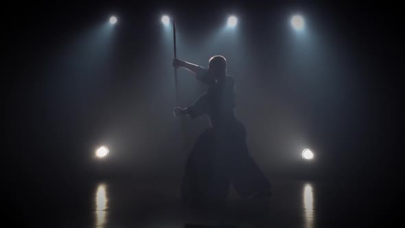 Kendo Instructor Practicing Martial Art with the Katana Sword. Slow Motion alt