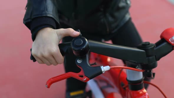 Smiling Schoolgirl in Helmet Pressing Bike Bell, Sport Activity, Childhood Hobby