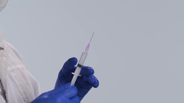 Microbiologist Medical Worker Blue Surgical Gloves Holding Syringe Vaccine Rapidly Spreading alt