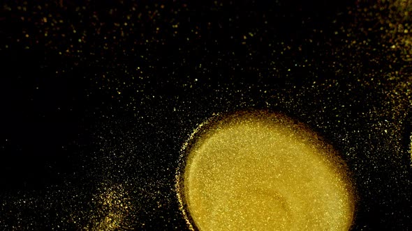 Gold Ink Particles Abstract Background with Oil Bubbles, Close-up