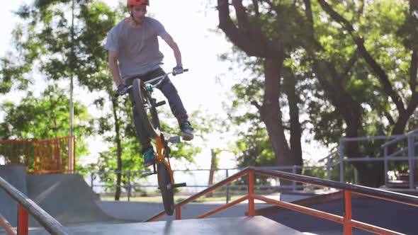 BMX Rider Doing Tricks in Cocncrete Skatepark Super Slow Motion alt