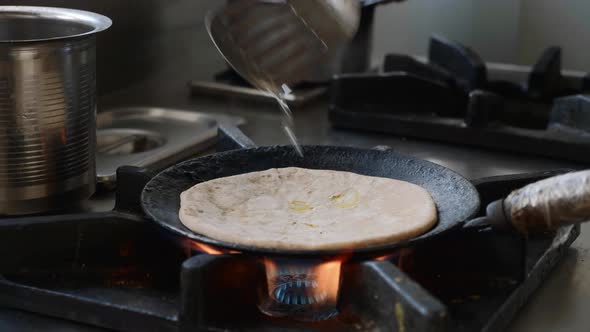 Preparing Indian Aloo Paratha in a Frying Pan