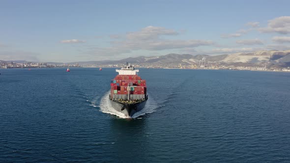 Ultra Large Loaded Container Ship Cruising in Open Ocean Aerial View alt