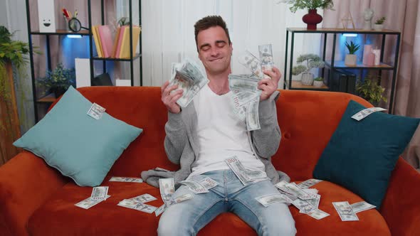 Successful Happy Rich Business Man Counting Money Cheering Up with High Profits Lottery Game Win alt