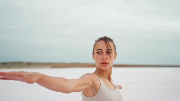 Yoga Woman Practices at Beach Working Out and Relaxing Outside on Beach at Sunrise alt