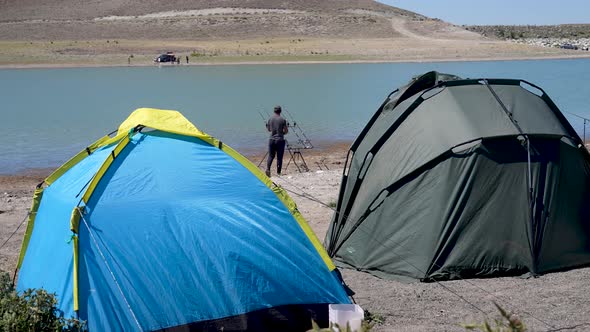 Professional fisherman by the lake alt