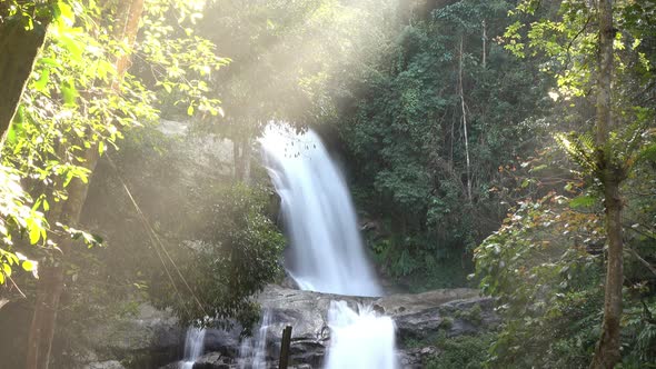 Waterfall In Forest With Sunlight alt