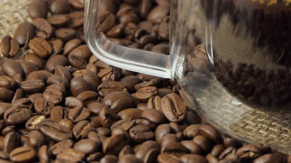 Cup of Coffee with Fresh Roasted Coffee Beans Background