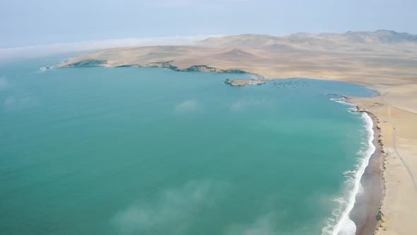 Drone shot coastline and desert in Paracas National Reserve in Peru 4K