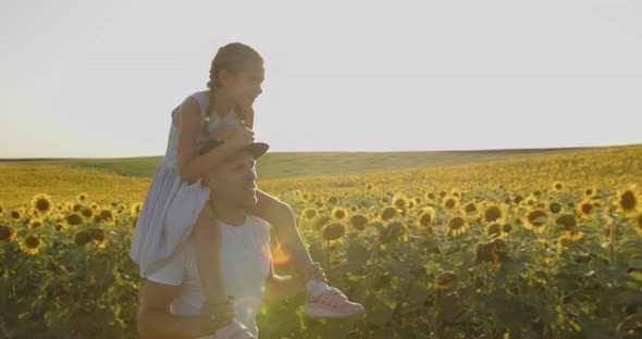 Dad With A Little Daughter On A Walk