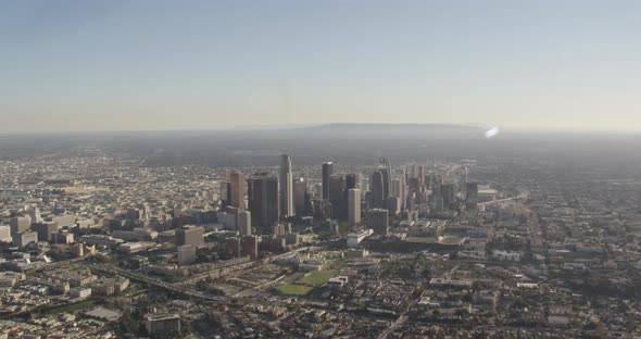 Helicopter aerial shot tracking above clouds and fog, day