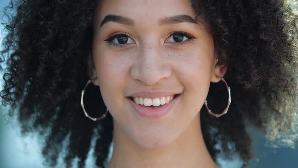 Beautiful Confident Young African Girl Laughs. Happy Ethnic Student with Brown Eyes, Curly Afro alt