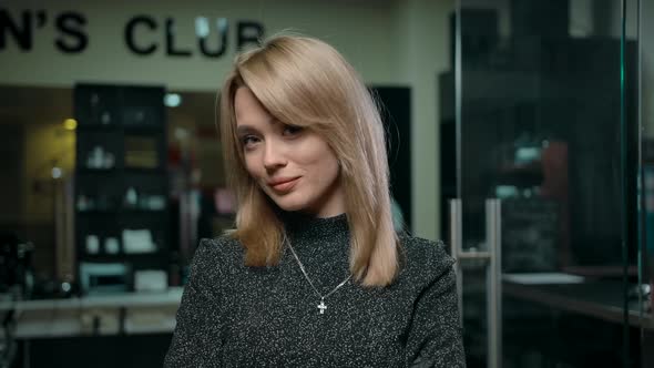 Female Barber Smiling for Camera alt