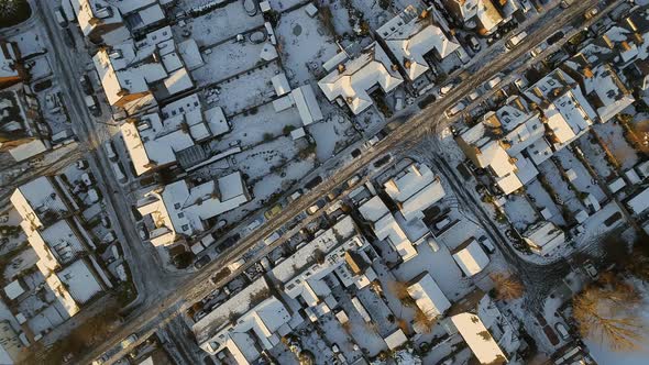 Snowy Streets and Houses in the Early Morning Bird's Eye View alt