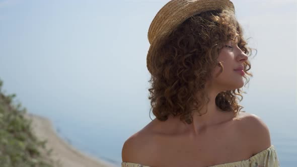 Girl Closing Eyes Putting Face Under Sunlight Closeup alt