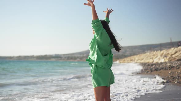 Side View of Happy Young Woman Inhaling Fresh Air Raising Hands Admiring Beauty of Picturesque alt
