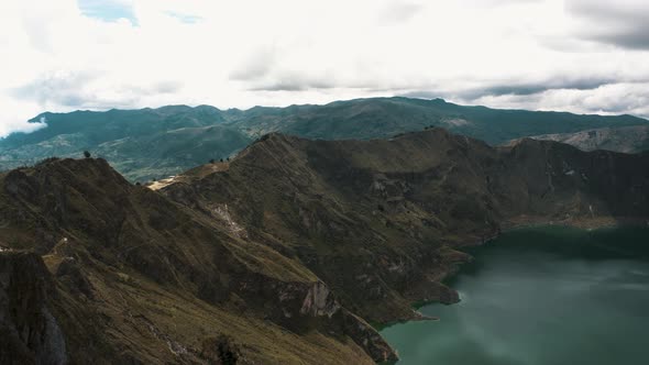 Hiking Path Along The Quilotoa Loop Around The Volcanic Crater Lake In Ecuador - aerial drone shot alt