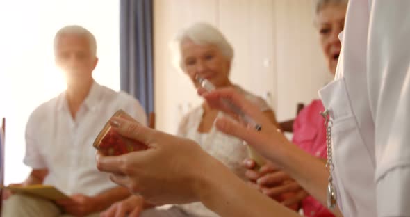 Therapist talking to senior people alt