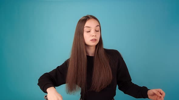 Lady Model in Black Brushes Hair alt