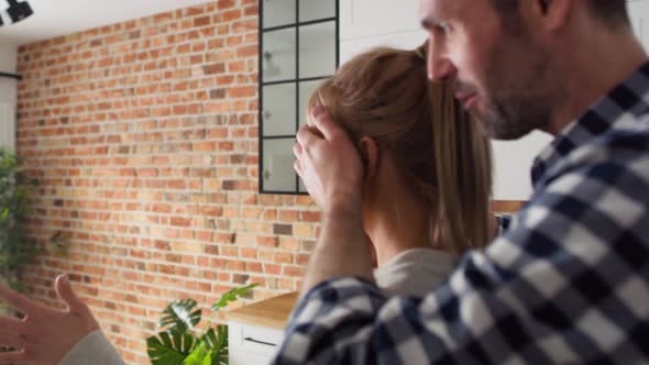 Tracking video of man surprising woman in new flat. Shot with RED helium camera in 8K. alt