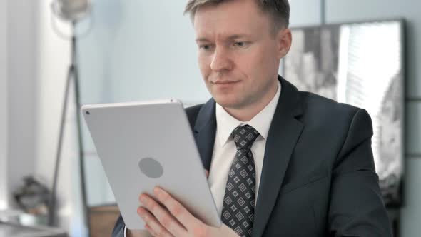 Businessman Using Tablet alt