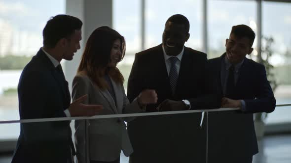 Joyous Business Group Chatting in Office Center alt