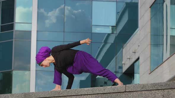 Strong Woman in Hijab Flexible Girl Doing Yoga Exercises on Street City Building Background Sport alt