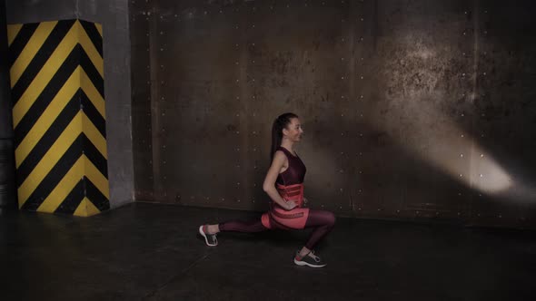 Athletic Beautiful Woman Doing Exercises in the Gym, Gym Training Routine. alt