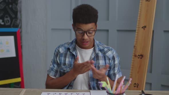 Millennial African American Teacher Speaking at Camera During Online Class