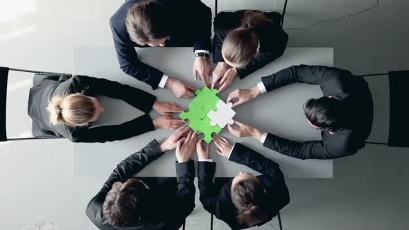 Business People and Puzzle alt