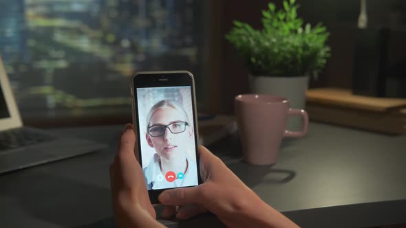 Vertical Smartphone Screen with Video Calling to the Blonde Woman in Glasses