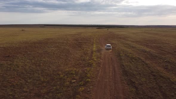 Aerial Photography of a Drone Taking Pictures of a Steppe Area a Rural Road in a Field in the