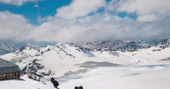 Timelapse Mountain Clouds Over Beautiful Snowcapped Peaks of Mountains and Glaciers alt