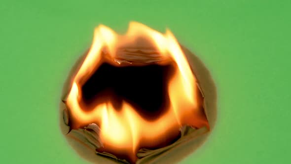 Green screen burning from center hole fire. Black behind, background.