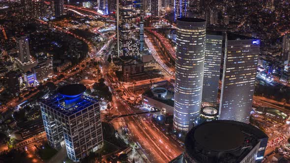 Night Tel Aviv business city center from birds view, Israel 4k aerial drone hyperlapse alt